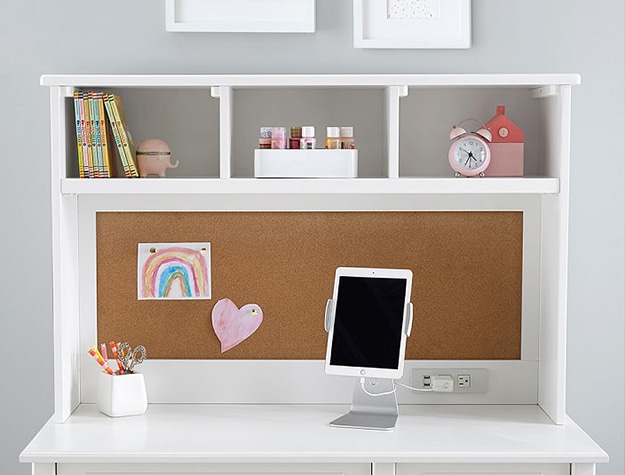 White desk with a tablet on top
