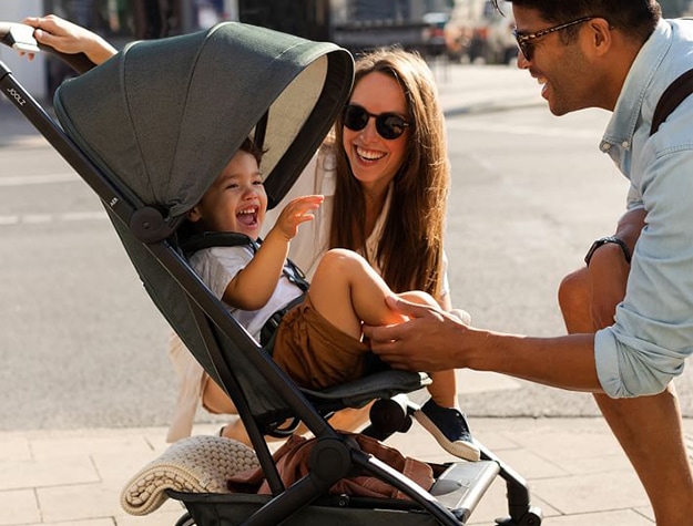 Happy family walking in the city