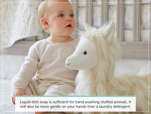 baby with plush llama