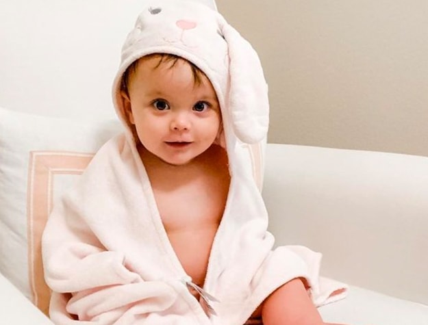 baby wrapped in bunny hooded towel