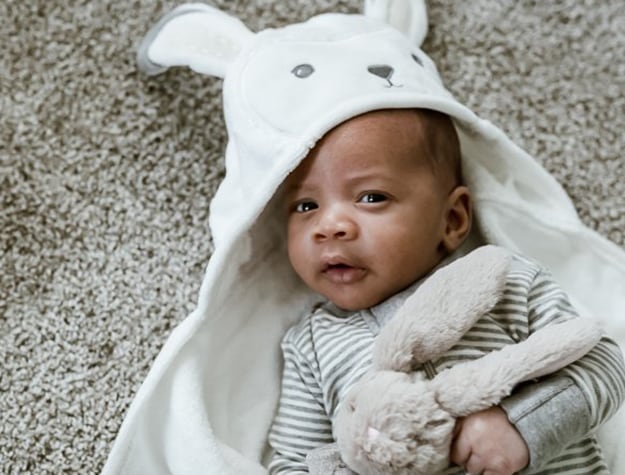 Baby in hooded blanket