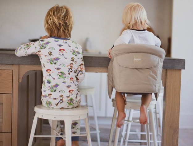 Boys eating breakfast with their backs to camera