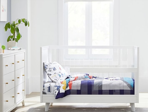 Convertible crib set up as a toddler bed