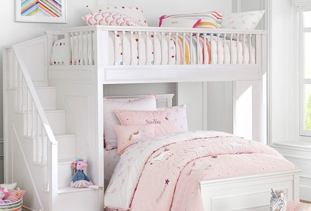White bunk bed with stairs in a unicorn-themed room