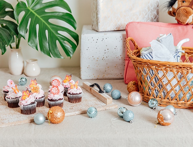 Table with cupcakes and ornaments