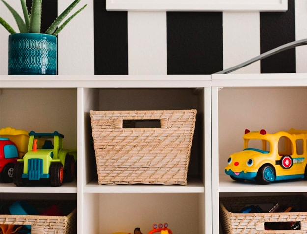 storage shelves with toys and wicker baskets