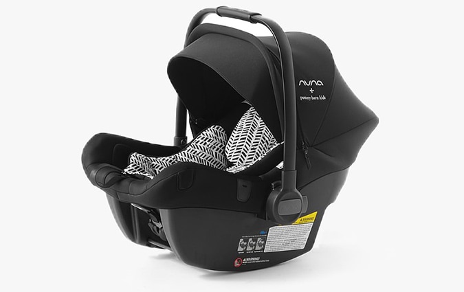 Baby car seat with black and white patterned interior