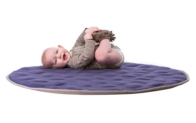 Baby on blue play mat