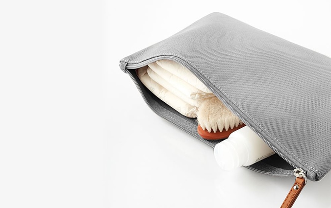 Grey wet/dry pouch with bath items inside