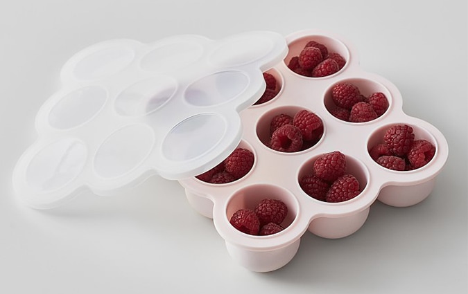 Frozen raspberries in pink container 