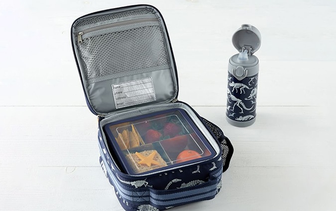 Open navy blue lunch box with food container inside