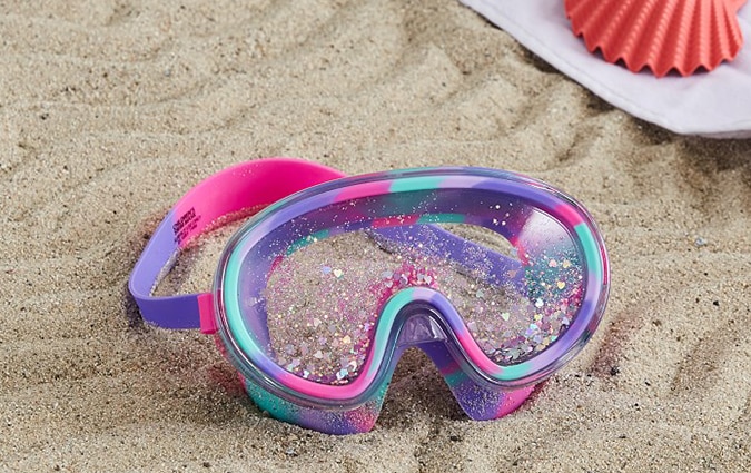 Glitter goggles in the sand