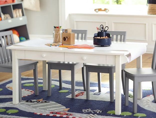 White play table with gray chairs