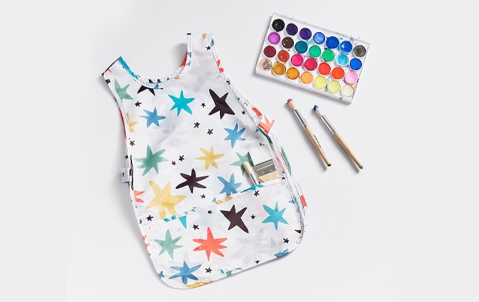 Star art smock with paint palette and brushes