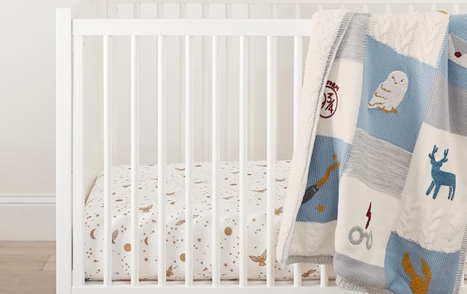 Harry Potter baby blanket hanging on white crib