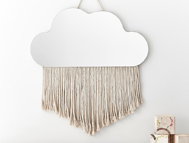 Hanging cloud fringe wall mirror.