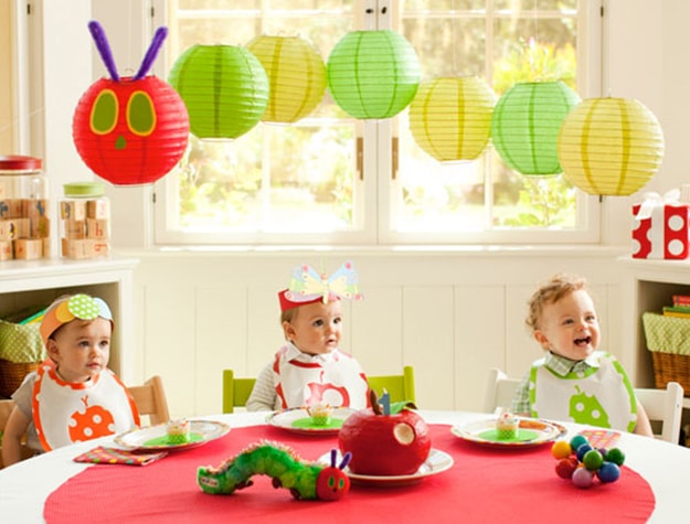 Babies at table with caterpillar lantern
