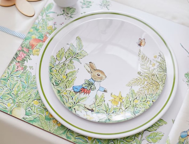 Close up of a matching Peter Rabbit plate and placemat set 