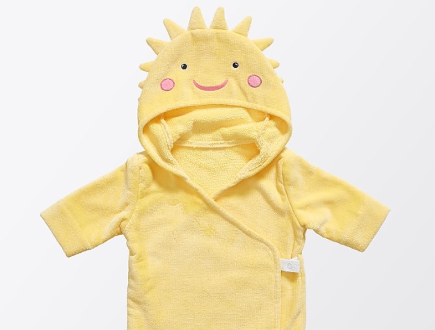 yellow baby robe with smiling sun face on hood