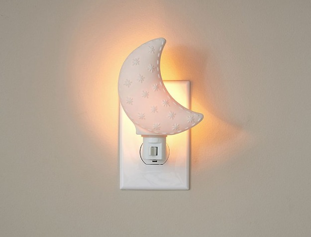 glowing moon nightlight plugged into wall