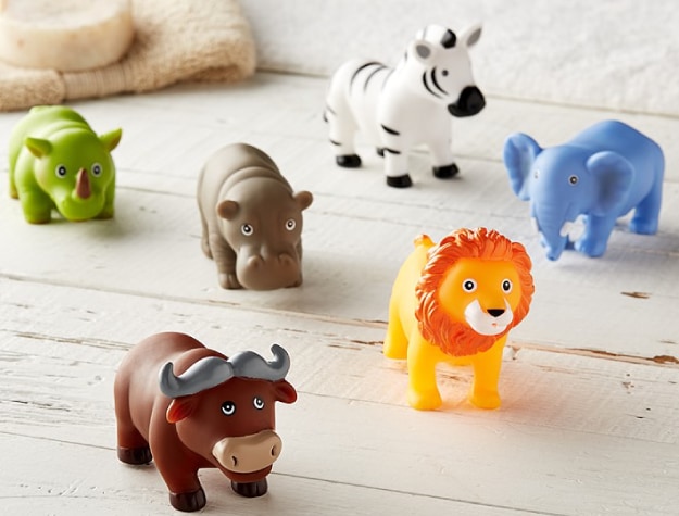 set of plastic animal toys on wooden surface