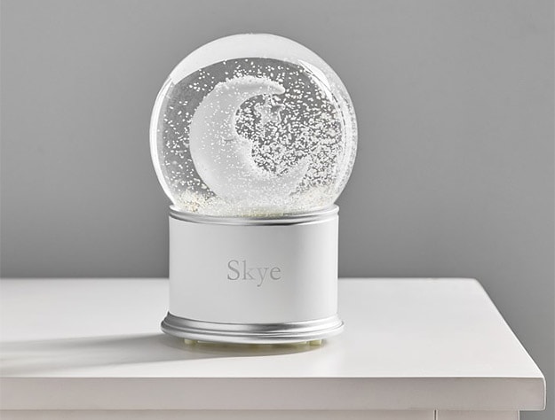 Sleepy Moon Light-Up Snow Globe on table.