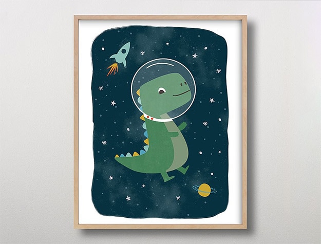 Minted® Dinos in Space Framed Art by Annie Holmquist on wall.