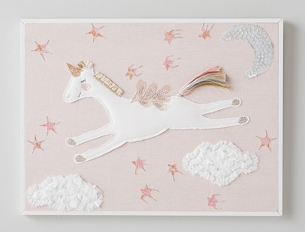Unicorn fabric applique art in white frame.
