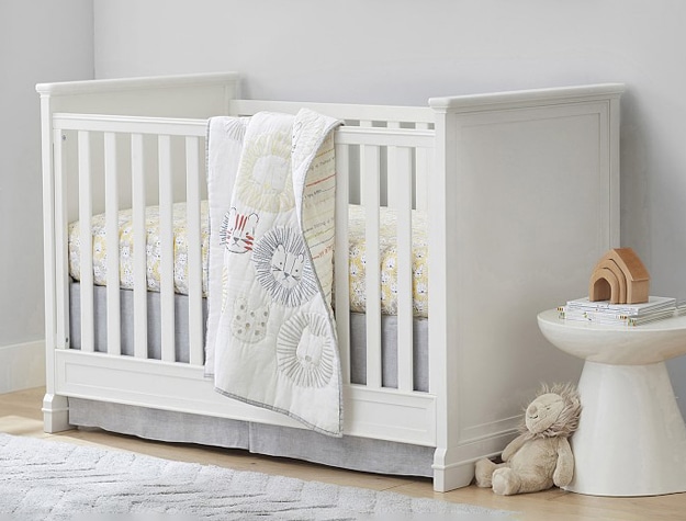 White Larkin Convertible Crib in jungle-themed nursery.