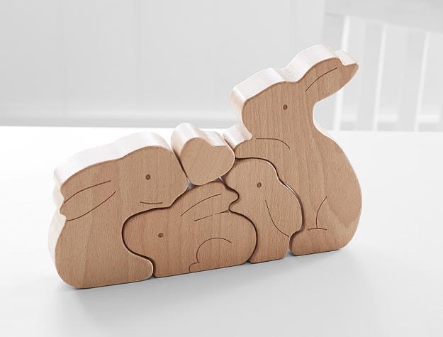Wooden Bunny Decorative Puzzle on a white table.