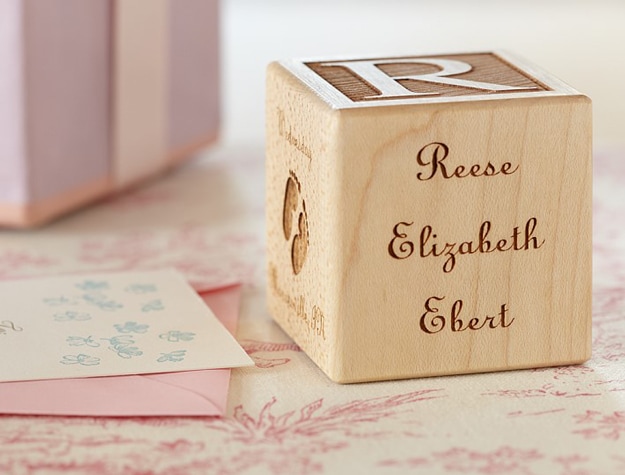 Personalized wooden block toy reading Reese Elizabeth Ebert.