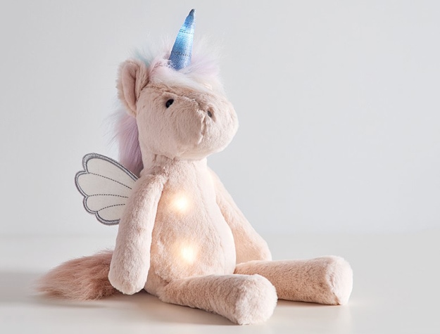 Unicorn Light Up Plush with lights glowing.