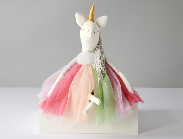 Modern Unicorn Designer Doll with multi-colored dress.