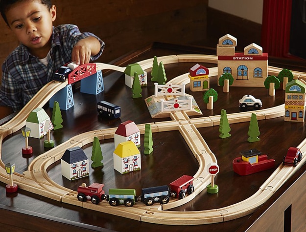Nephew playing with gifted Town and Country Wooden rustic train set.