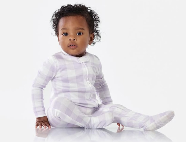 A baby wearing TENCEL™ change of pajamas.