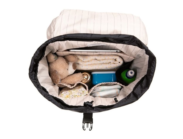 Storsak Travel Eco Backpack containing toys, blankets, wipes, medications and tablet.