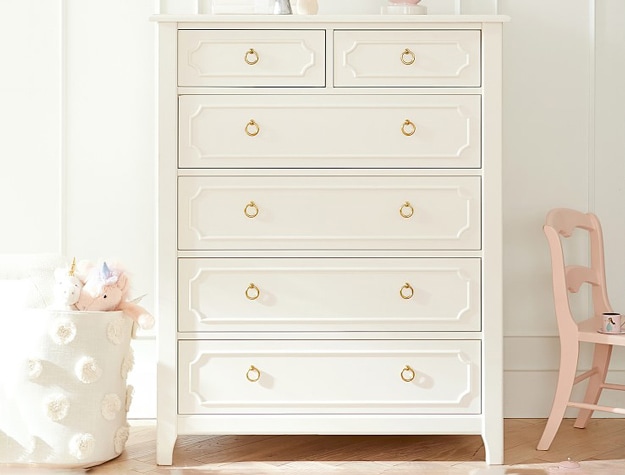 Tall white dresser with gold pulls.