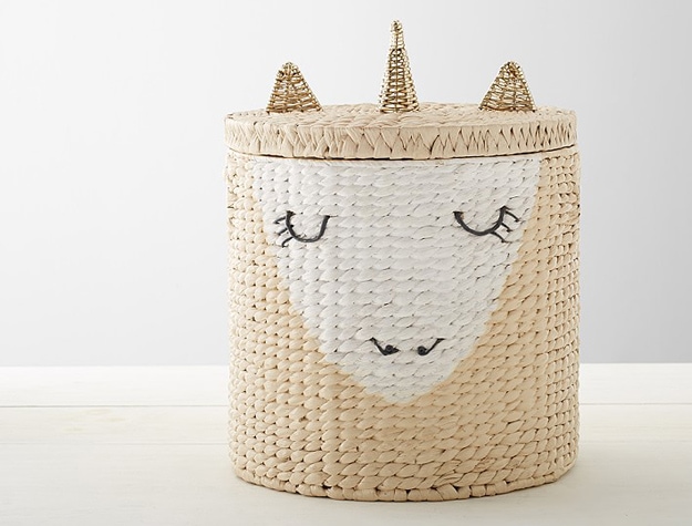 Woven hamper and lid with peaceful unicorn face.