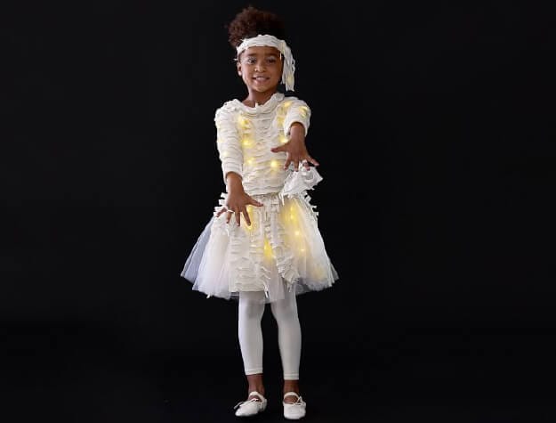 Child wearing mummy costume