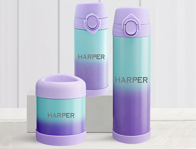 Three turquoise-and-purple ombre water bottles with personalization.