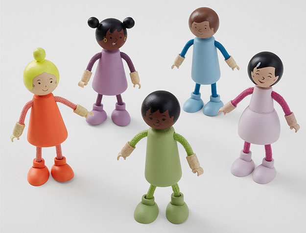 Five small wooden dolls in rainbow colors.