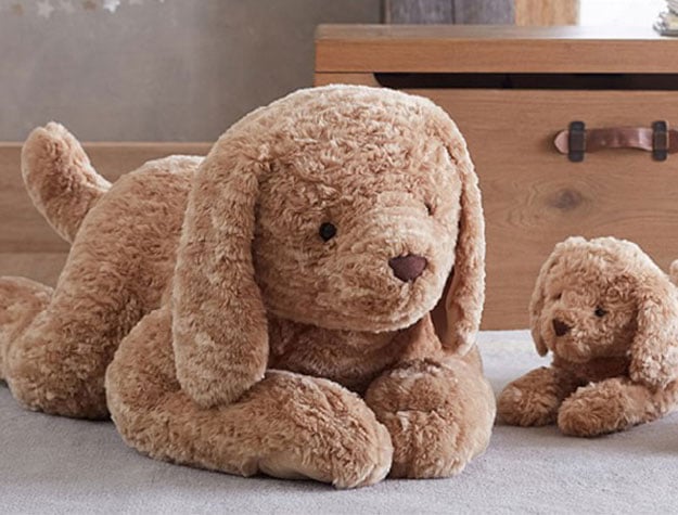 A large plush Labradoodle toy with two smaller plush Labradoodles.