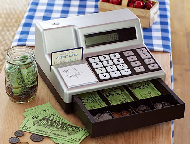 Silver cash register with play money.