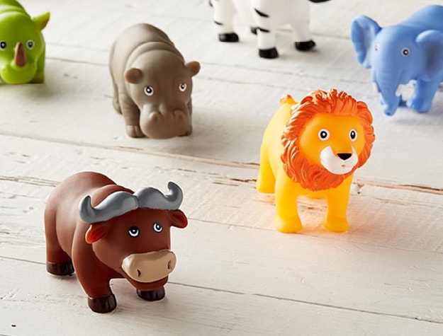 A Jungle Bath Squirties set with a plastic elephant, lion, hippo and other assorted bath toy animals.