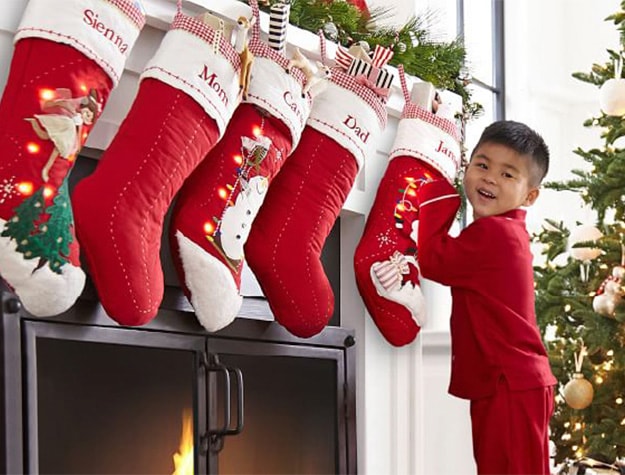 boy and girl opening christmas stockings