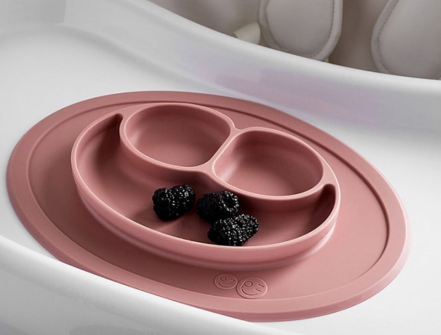 Pink silicone feeding mat with blackberries.