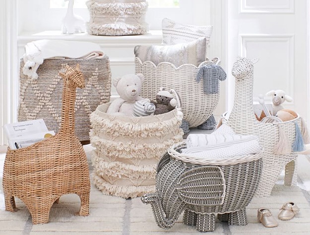 Various nursery storage options holding stuffed animals, linens, books, pillows and toys.