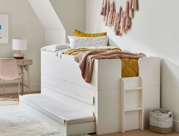 white captain's bed with extra trundle pullout