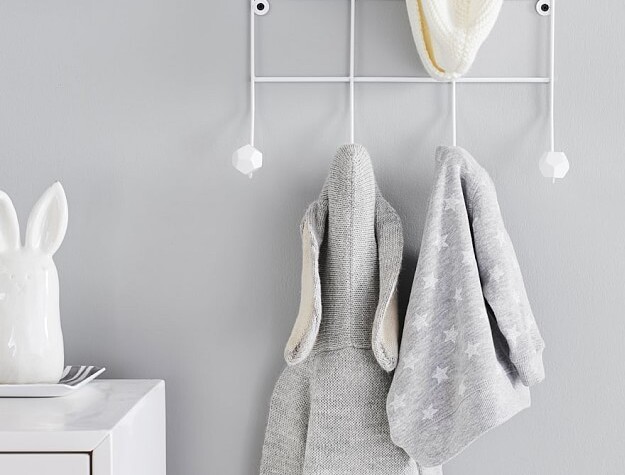 Wall hooks with gray clothing