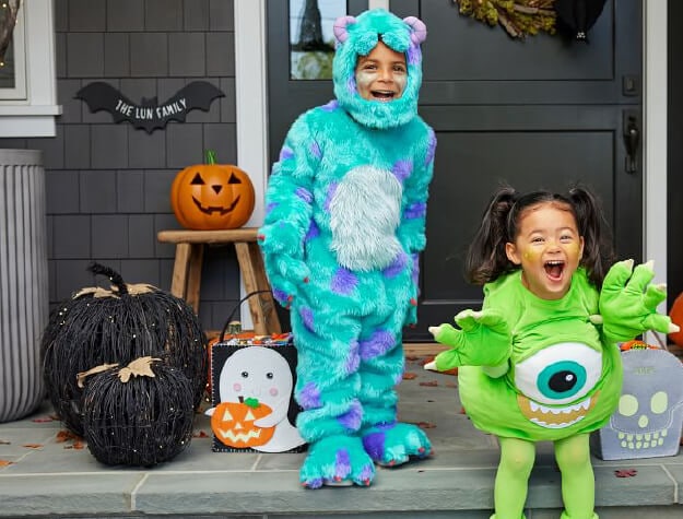 Kids dressed in Monsters Inc. Halloween costumes